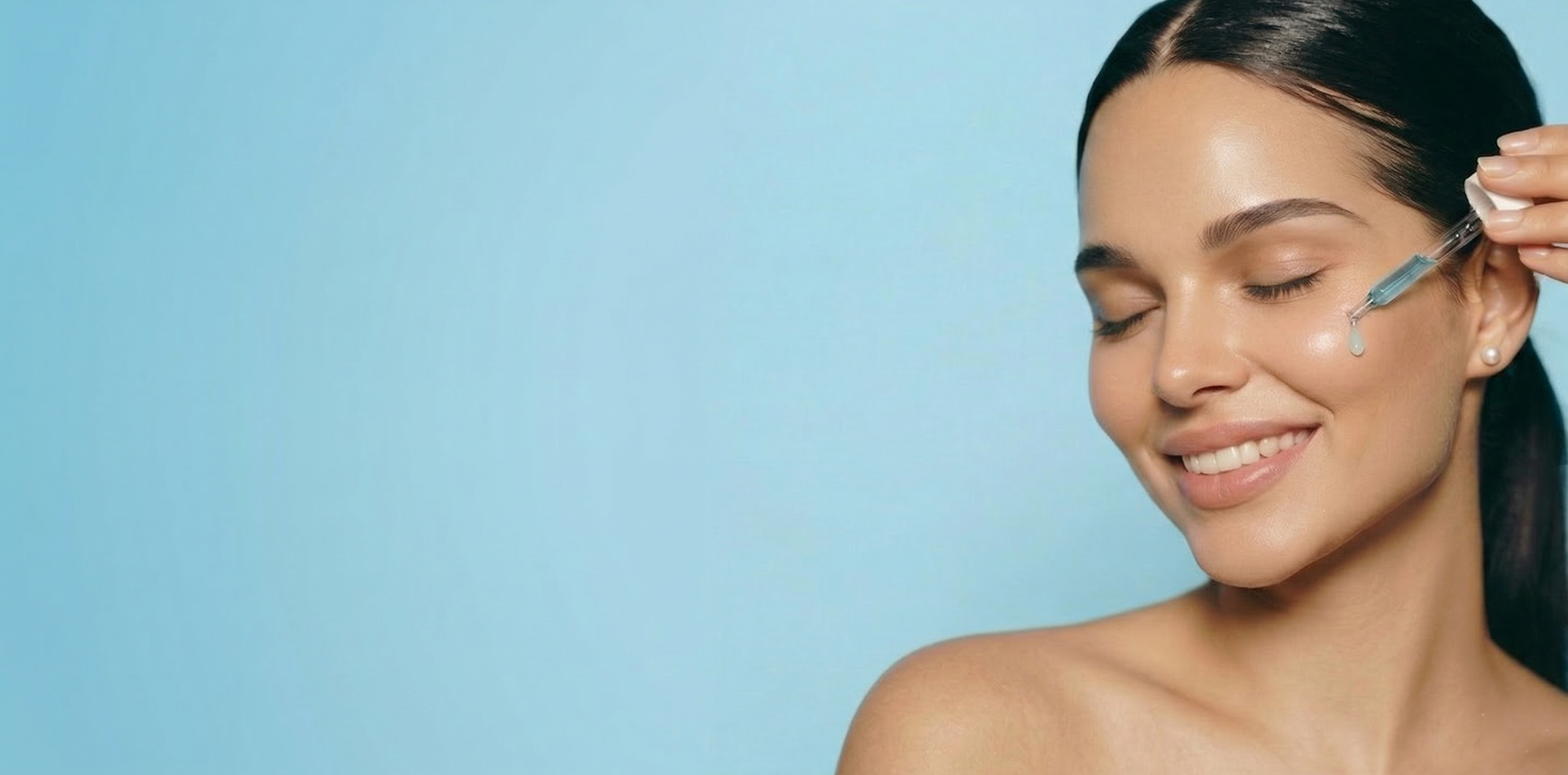Woman applying skincare product with a brush on a blue background